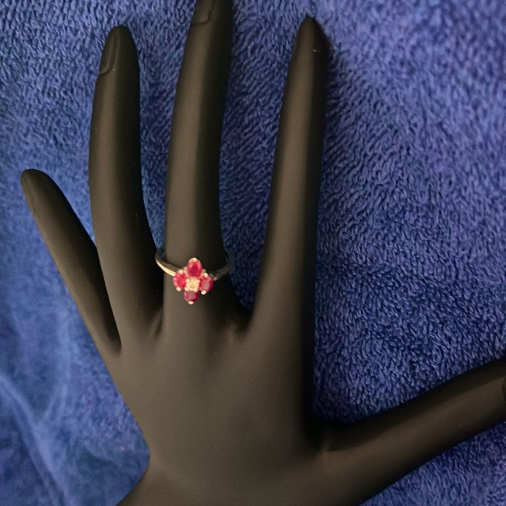 Beautiful ruby, and diamond flower shape Ring.